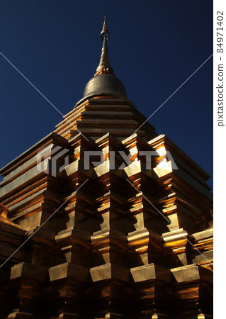 Chiang Mai, Thailand Golden Chedi (stupa) shining in the sunlight of everlasting summer 84971402