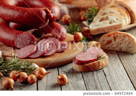 Bread and smoked sausage. Bread and smoked sausage. 84972484