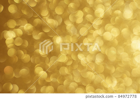 Golden bokeh background. Texture foil and confetti bokeh, light of golden dust. Festive party Christmas and new year's eve background. 84972778