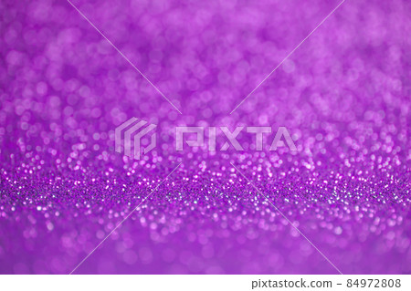 Glitter purple pink background. Texture foil and confetti bokeh, light of purple pink dust. Festive party Christmas and new year's eve background. Glitter purple pink background. Texture foil and confetti bokeh, light of purple pink dust. Festive party Christmas and new year's eve background. 84972808