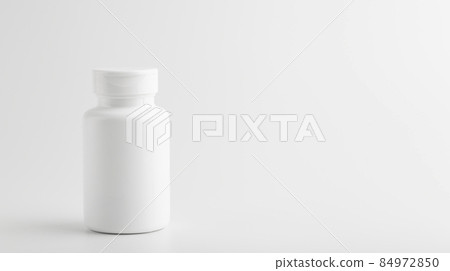 Jar of pills isolate. White plastic jar for medical pills, drugs and vitamins on a blank white background. Jar of pills isolate. White plastic jar for medical pills, drugs and vitamins on a blank white background. 84972850