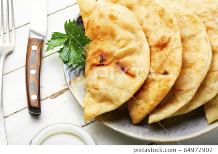 Traditional homemade pasties, cheburek Traditional homemade pasties, cheburek 84972902