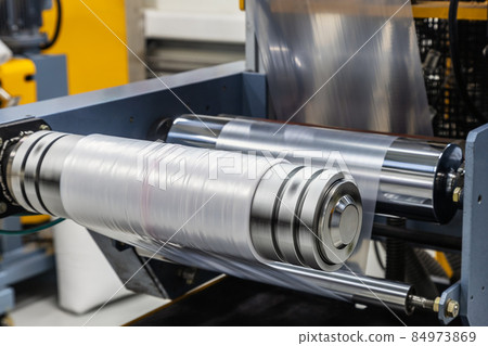 machine with roll of newly produced transparent plastic film 84973869