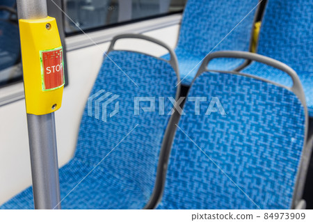 stop button modern and comfortable interior of the city bus 84973909