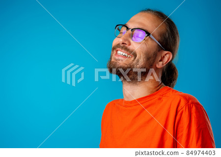 Portrait of a funny nerd man in glasses Portrait of a funny nerd man in glasses 84974403