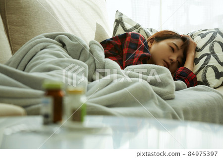 A young woman with poor physical condition 84975397