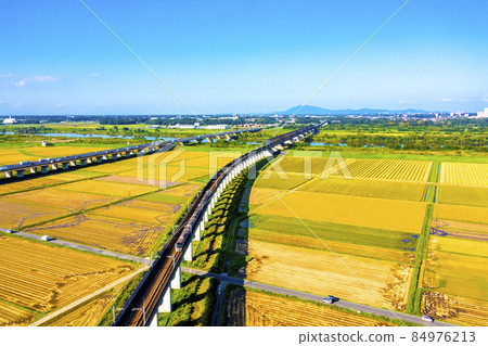 Tsukuba Express and Joban Expressway crossing the Tone River with Mt. Tsukuba in the background 84976213