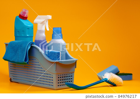 Home cleaning tools on yellow studio background 84976217