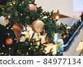 Christmas decorations on the Christmas tree.  84977134