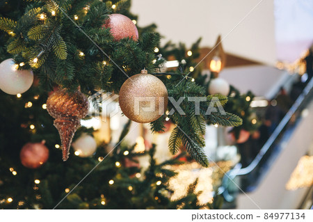Christmas decorations on the Christmas tree.  84977134