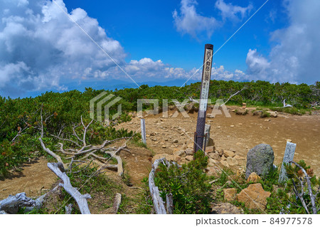 Northern Yatsugatake in summer Mountaintop signpost of Mt. Nishitengu Northern Yatsugatake in summer Mountaintop signpost of Mt. Nishitengu 84977578