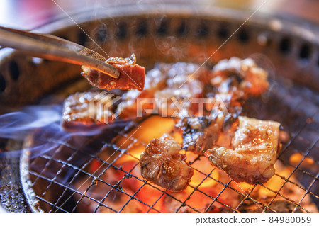 Delicious meat grilled over charcoal 84980059