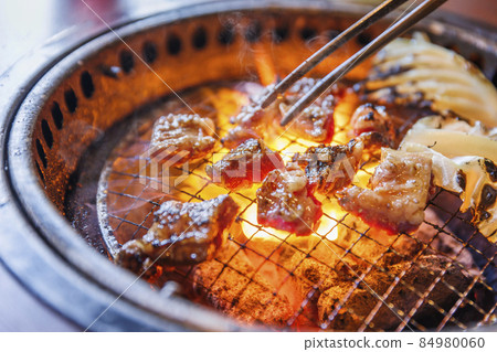 Delicious meat grilled over charcoal Delicious meat grilled over charcoal 84980060
