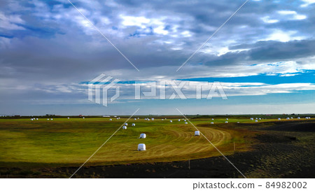 Agriculture landscape with hay bales, Iceland Agriculture landscape with hay bales, Iceland 84982002