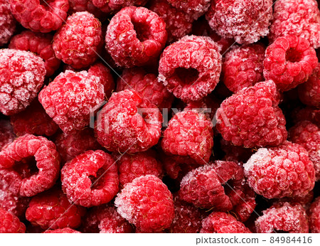 Frozen raspberries background. The view from top 84984416