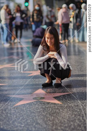 A young Japanese woman sightseeing in Hollywood, Los Angeles, USA A young Japanese woman sightseeing in Hollywood, Los Angeles, USA 84985029