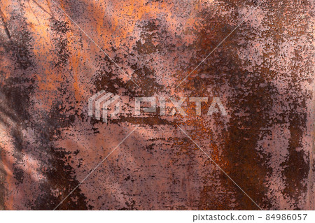Rusty metal background. Red metal texture with rust. Rust stains a lot and Sun rays, noisy background. Rusty metal background. Red metal texture with rust. Rust stains a lot and Sun rays, noisy background. 84986057