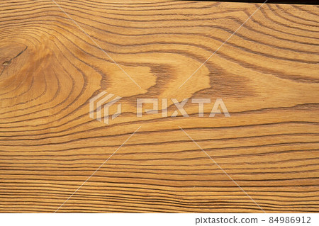 The appearance of oak-colored pine wood. Brushed board. Creative vintage background. 84986912