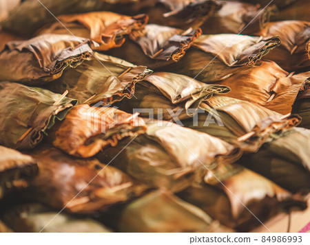 Thai traditional dessert. Grilled Taro Stuffed Coconut Sticky Rice 84986993