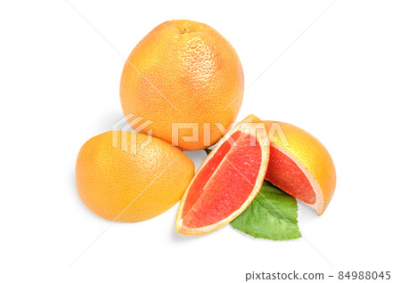 Grapefruit with wedges on white background Grapefruit with wedges on white background 84988045