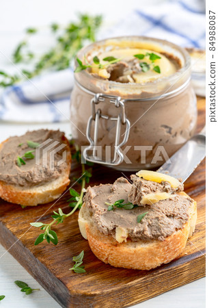 Homemade pate on baguette slices. Homemade pate on baguette slices. 84988087