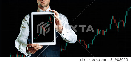 Shares financial. Businessman holding finance application for sell, buy and analysis profit dividend statistics. Investment business technology app on digital screen. Business graph background. 84988093