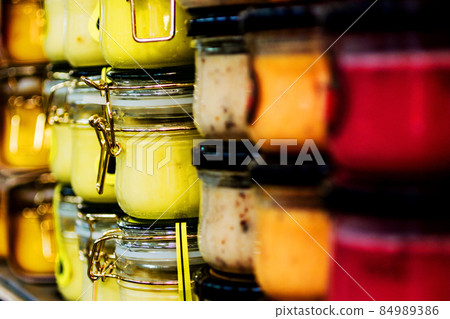 jars with sauces in the store 84989386