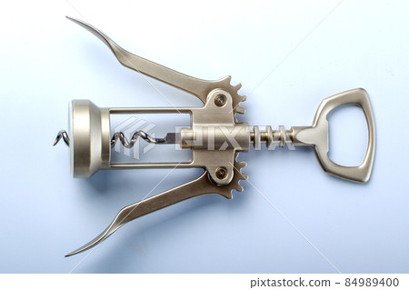 one metal corkscrew on light blue background one metal corkscrew on light blue background 84989400