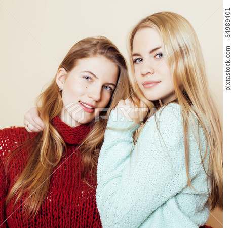best friends teenage girls together having fun, posing emotional on white background, besties happy smiling, lifestyle people concept close up. making selfie best friends teenage girls together having fun, posing emotional on white background, besties happy smiling, lifestyle people concept close up. making selfie 84989401