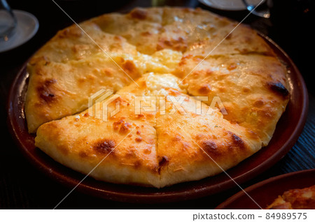 Close up of fresh Ossetian pie with potato Close up of fresh Ossetian pie with potato 84989575