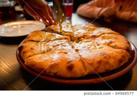 Close up of fresh Ossetian pie with beef meat 84989577