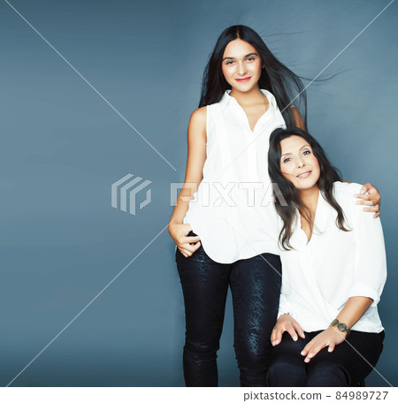 cute pretty teen daughter with mature mother hugging, fashion style brunette, lifestyle people concept cute pretty teen daughter with mature mother hugging, fashion style brunette, lifestyle people concept 84989727