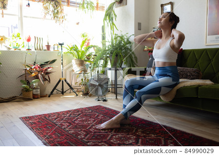 A cute woman who trains in the room 84990029