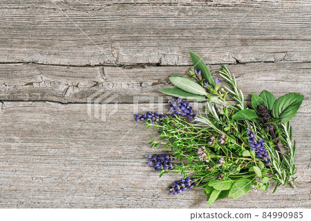 Fresh herbs wooden background. Basil rosemary mint sage thyme lavender Fresh herbs wooden background. Basil rosemary mint sage thyme lavender 84990985