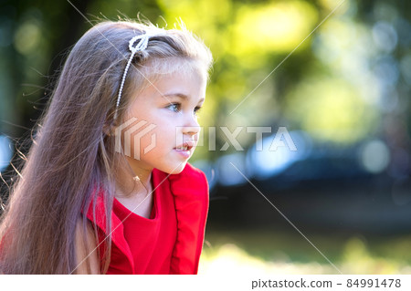 Portrait of happy beautiful child girl outdoors enjoying warm sunny summer day. Portrait of happy beautiful child girl outdoors enjoying warm sunny summer day. 84991478