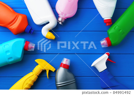 Household cleaning supplies on blue wooden background flat lay Household cleaning supplies on blue wooden background flat lay 84991492
