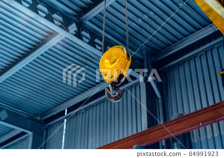 Industrial crane hook in a modern factory building 84991923