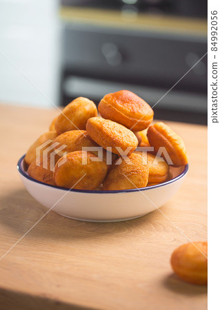 Traditional Kazakh baursak dish prepared with dough Traditional Kazakh baursak dish prepared with dough 84992056