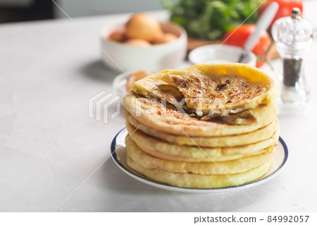 Khachapuri cheese bread, traditional caucasian food on a white background Khachapuri cheese bread, traditional caucasian food on a white background 84992057