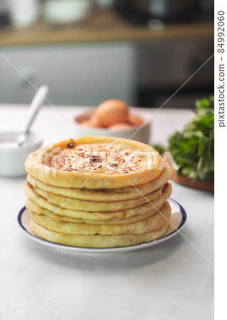 Khachapuri is cheese bread, traditional caucasian food on a white background Khachapuri is cheese bread, traditional caucasian food on a white background 84992060