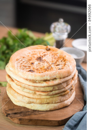 Khachapuri is cheese bread, traditional caucasian food, vertical orientation Khachapuri is cheese bread, traditional caucasian food, vertical orientation 84992066