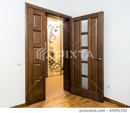 New brown wooden door in house interior New brown wooden door in house interior 84992200
