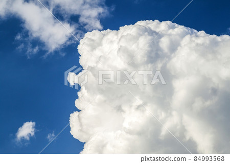 Blue sky with puffy white clouds in bright clear sunny day Blue sky with puffy white clouds in bright clear sunny day 84993568