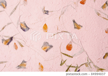 mulberry paper with red and yellow flower petal and seed texture background. 84994837