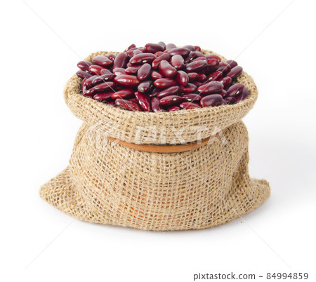 Red small Azuki beans (Adzuki or japanese red bean) in sack bag. Red small Azuki beans (Adzuki or japanese red bean) in sack bag. 84994859
