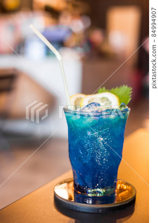 Blue cocktail drink with ice. 84994907