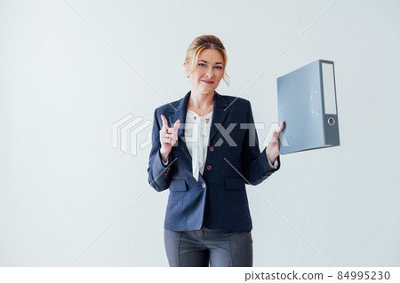 business woman with paper folder at work in office 84995230