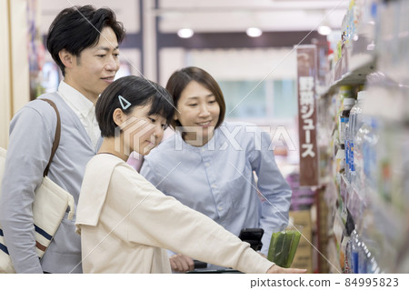 Family shopping at a supermarket Family parent and child 84995823