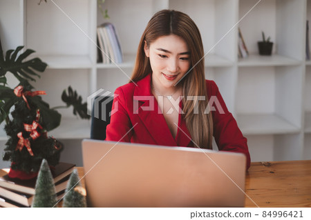 A business woman using laptop computer to cyber security for her saving account, business, technology, future, digital asset Concept. 84996421