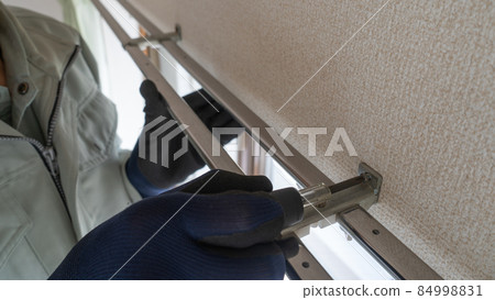 Image of workers installing curtain rails Image of workers installing curtain rails 84998831